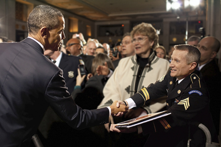 Obama shakes hands with Ingram